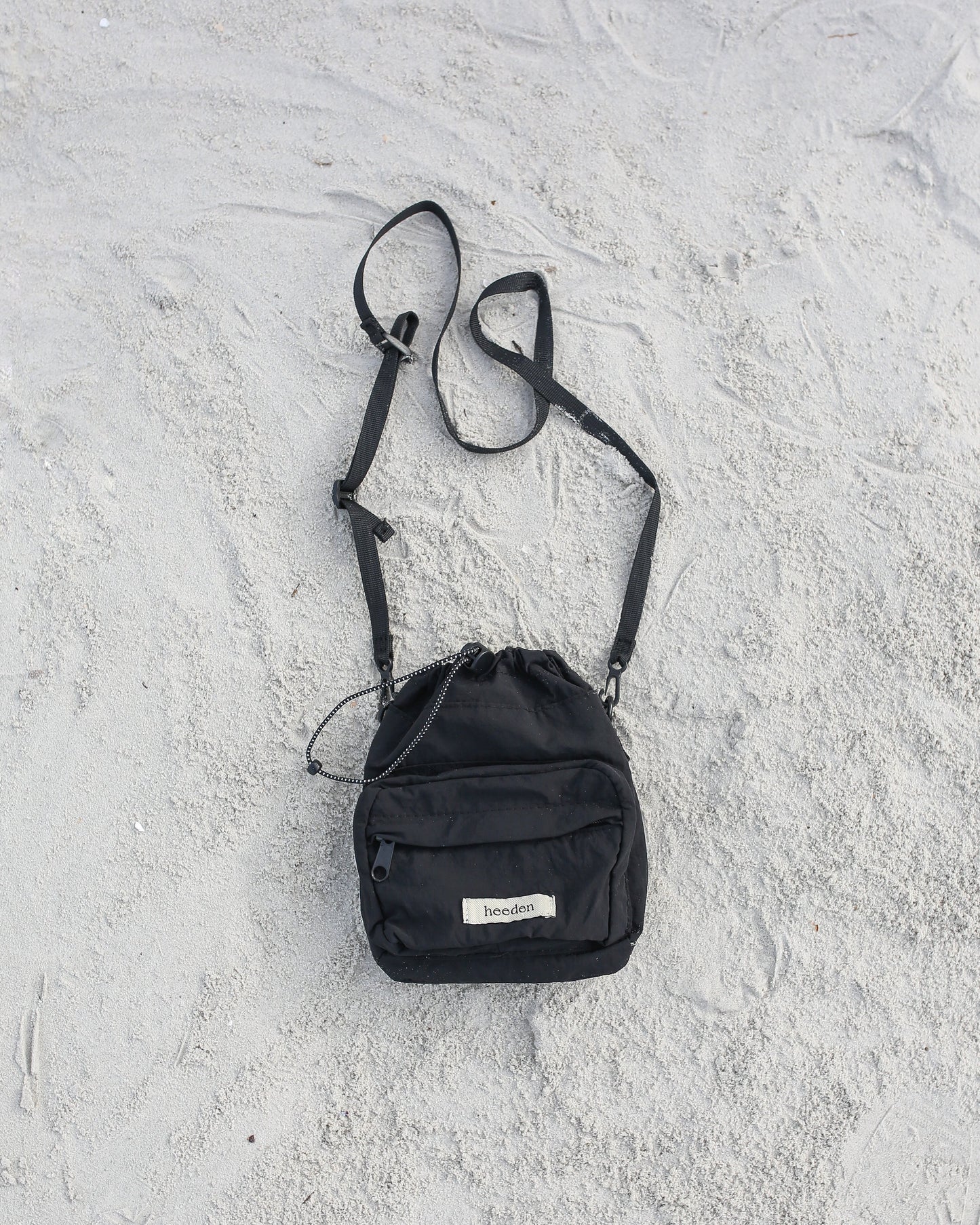 Mini Dumpling Sling Bag in Black