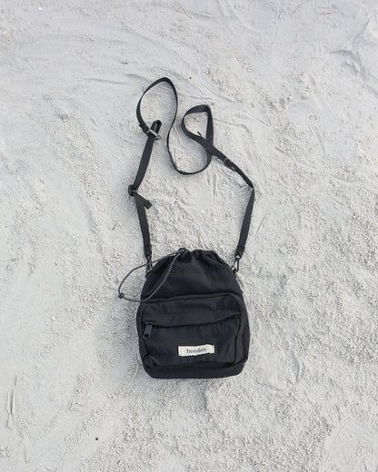 Mini Dumpling Sling Bag in Black