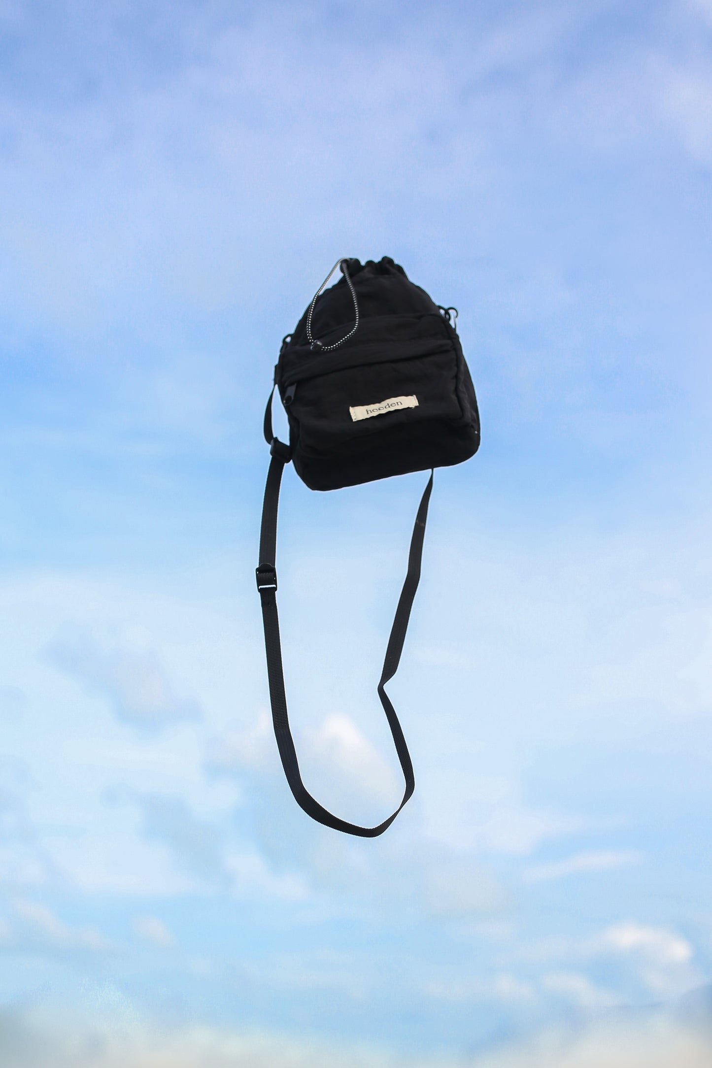 Mini Dumpling Sling Bag in Black