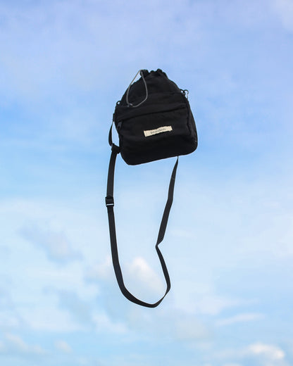 Mini Dumpling Sling Bag in Black