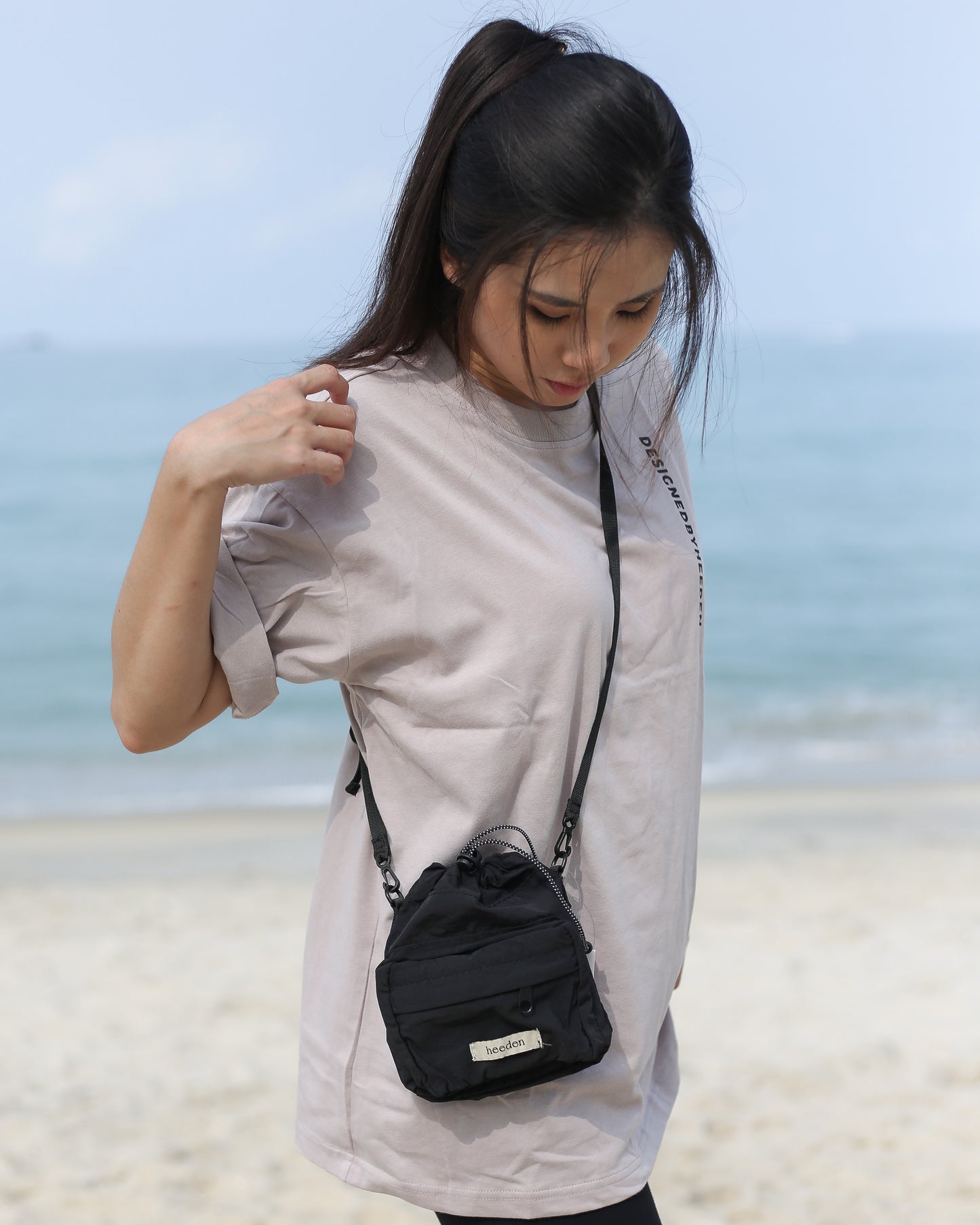 Mini Dumpling Sling Bag in Black