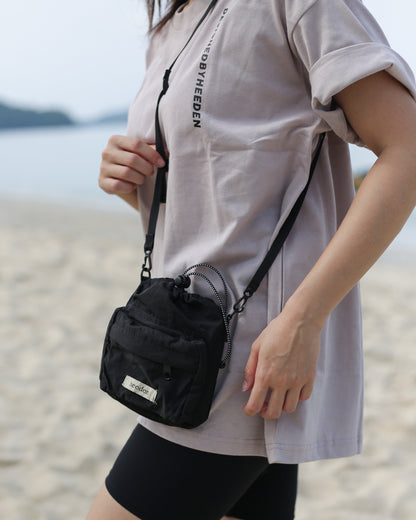 Mini Dumpling Sling Bag in Black